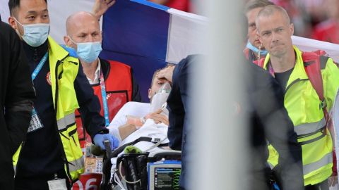 Christian Eriksen being taken on a stretcher.